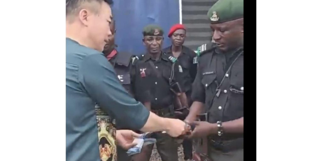 Nigerians in Diaspora Organzation condemns viral video of Chinese giving cash to police
