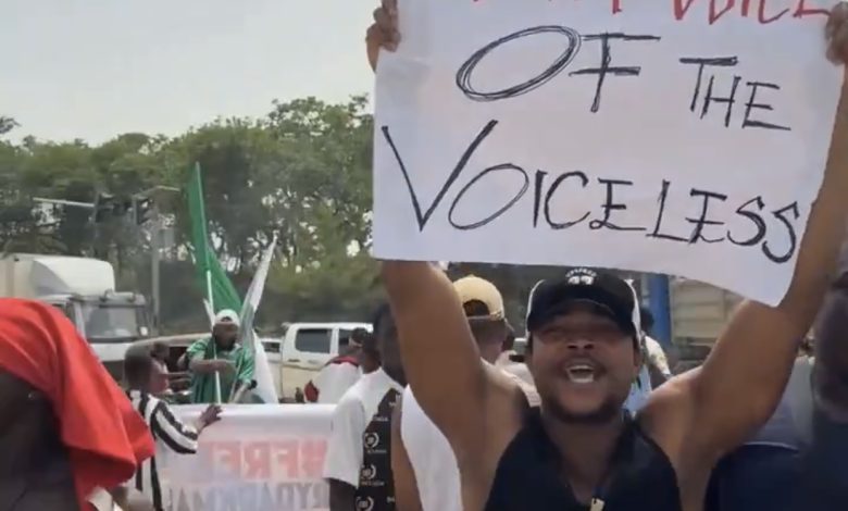 Nigerian youths protest over the arrest of very dark man in Abuja
