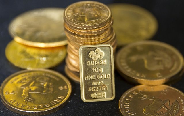 Dollar declines as gold prices rise