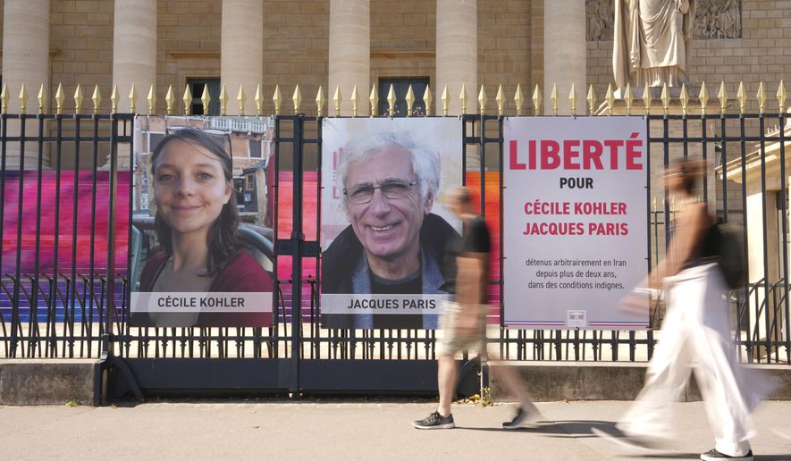 French foreign minister condemns spy charges against couple jailed in Iran