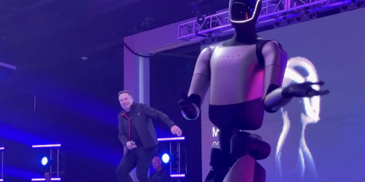 Elon Musk does weird dance with robot at shareholder meeting