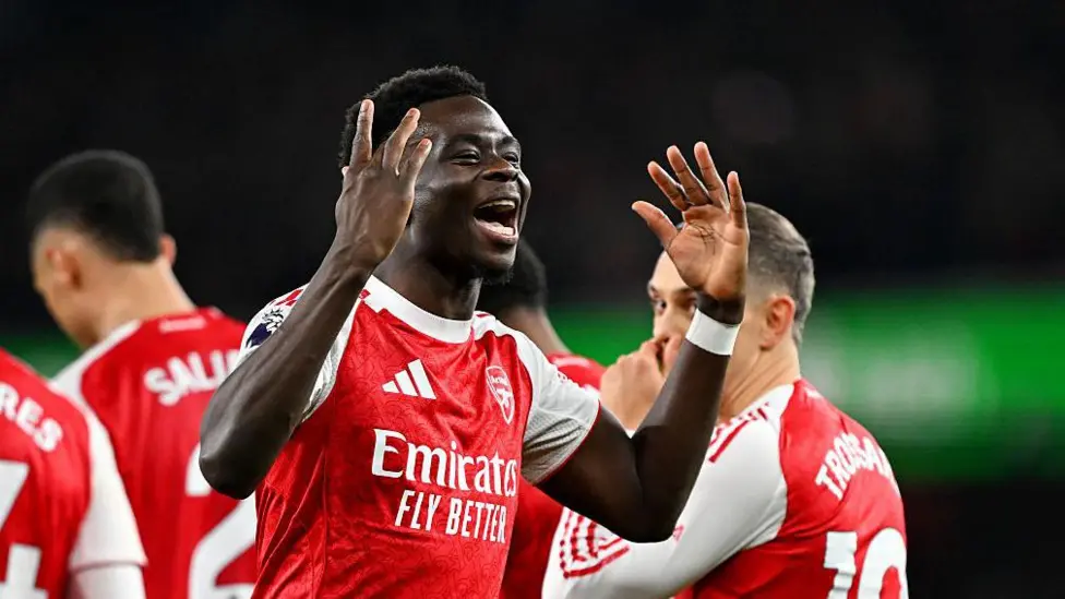 Arsenal edge Wolves with late own goals to go five clear