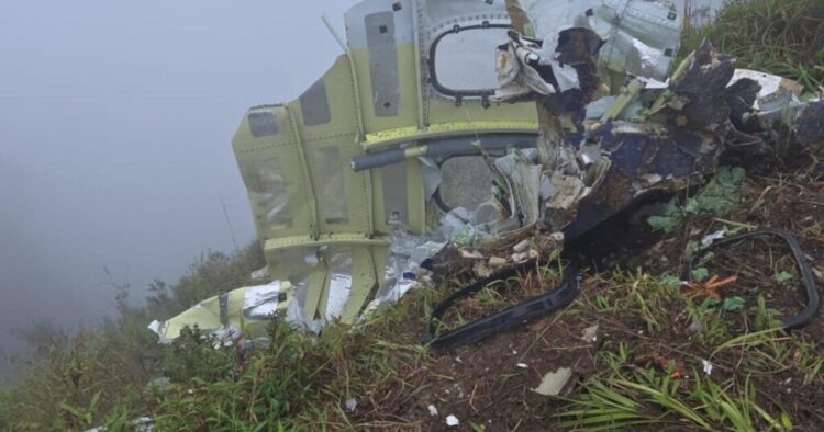 Indonesian rescuers recover body near crashed plane with 11 aboard